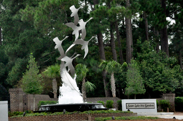 a metal schulpture and a water fountain